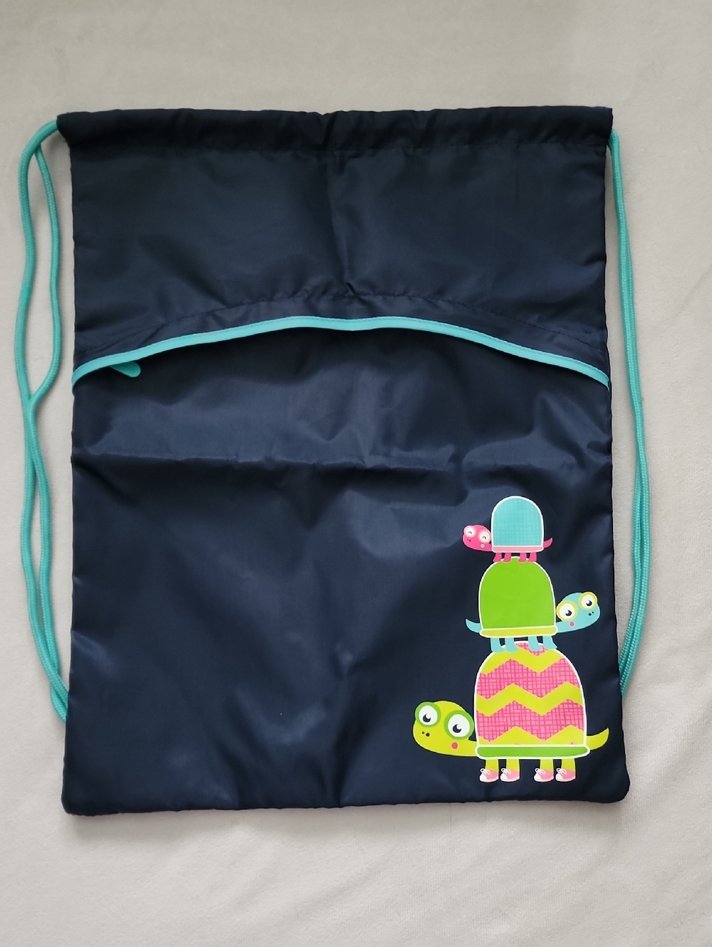 thirty-one Navy Drawstring Bag with Teal Trim and Colorful Turtle Stack